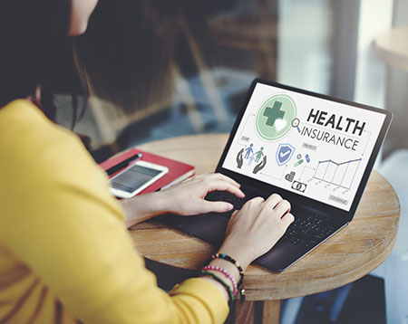 woman looking at insurance information 